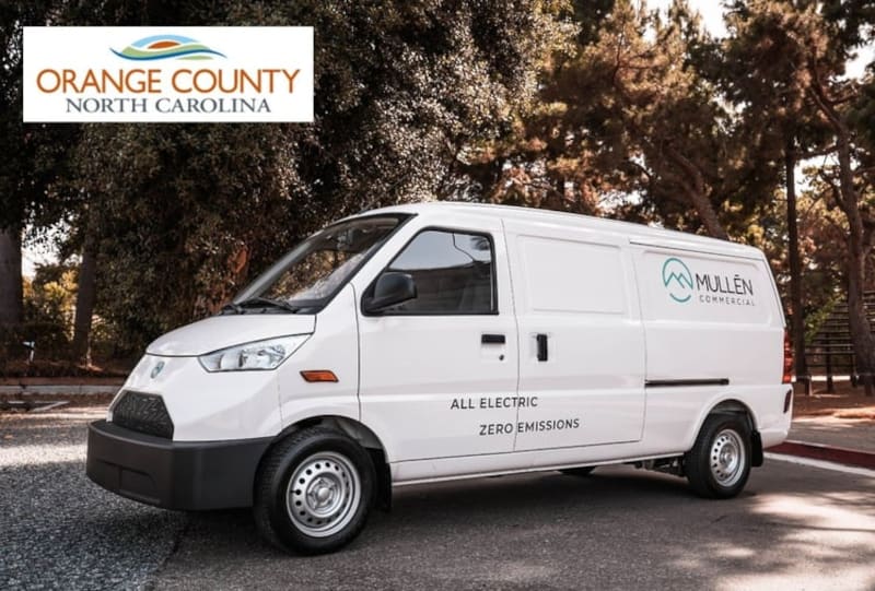 White delivery van against a wooded background, and inset logo for Orange County, NC.