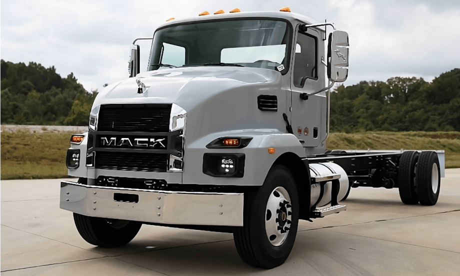 Gray chassis cab Mack truck parked.