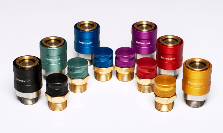 Various colors of fluid drain plugs against a white background.