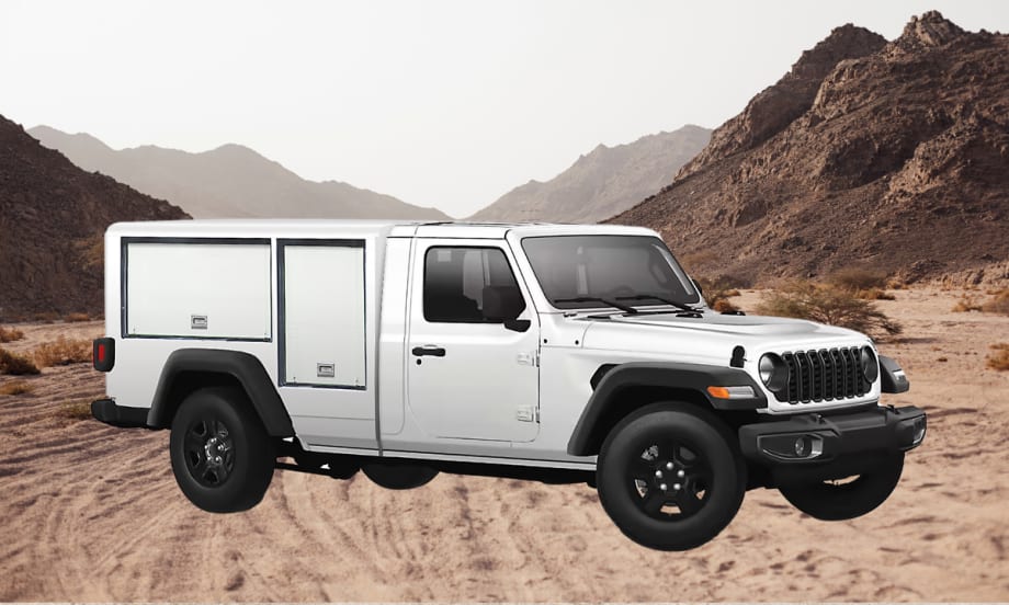 White work truck that looks like a Jeep parked in front of a desert scene.