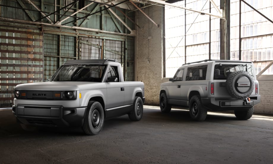 Image of gray compact pickup truck and SUV parked in an old warehouse.