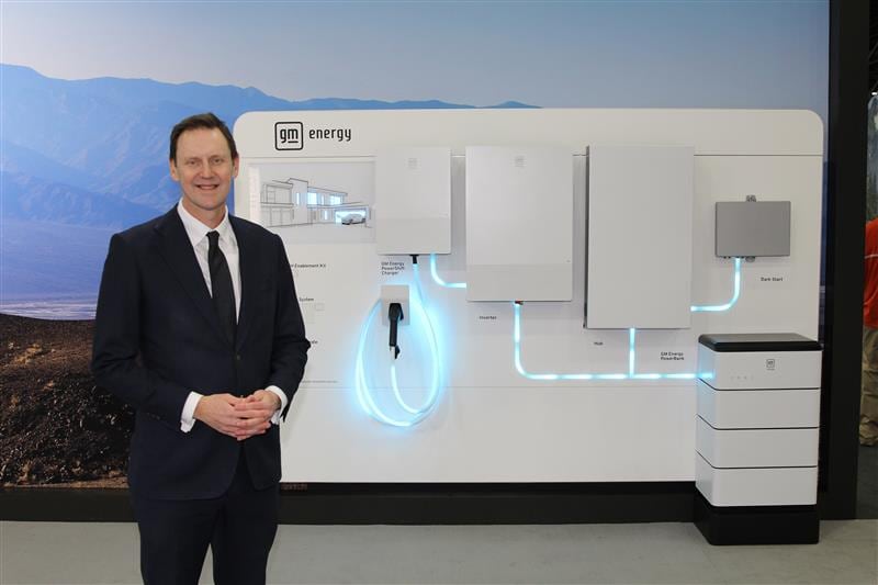 Duncan Alrdred in front of a display of GM Energy products