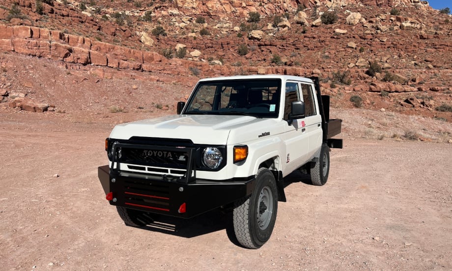 White Toyota Land Cruiser in an offroad environment.