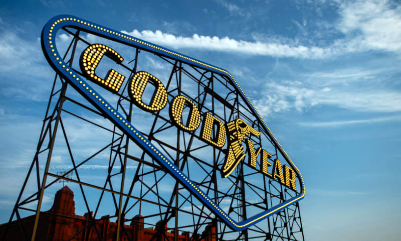 Goodyear sign against blue sky.