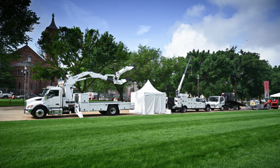White work trucks on display.
