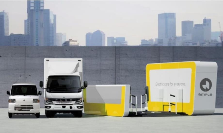 Graphic image showing two Mitsubishi commercial trucks and an EV battery swapping system.