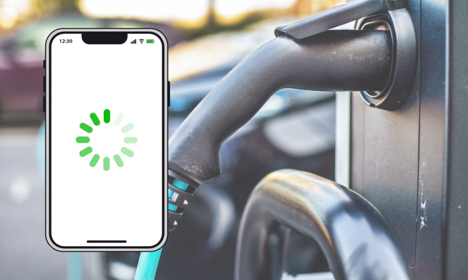 A smartphone with a loading icon displayed on the screen appears in front of an electric vehicle charging station, symbolizing delays or connectivity issues with EV mobile apps.