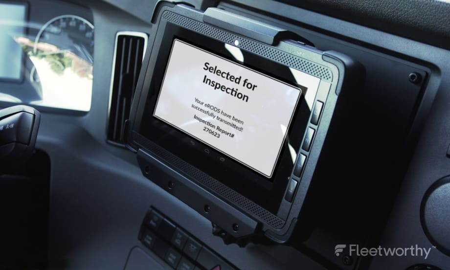 Information displayed on an ELD inside a commercial truck cab.