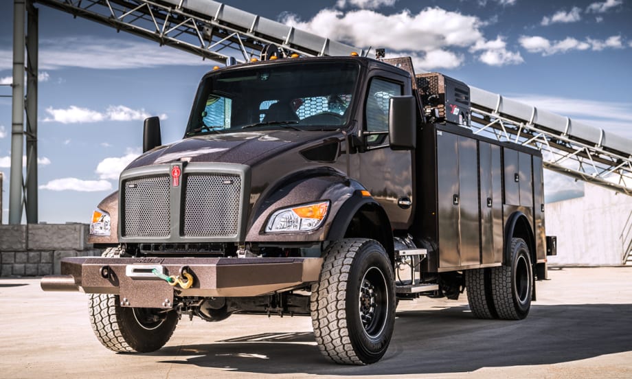 Photo of a medium-duty Kenworth service truck parked at a mine.
