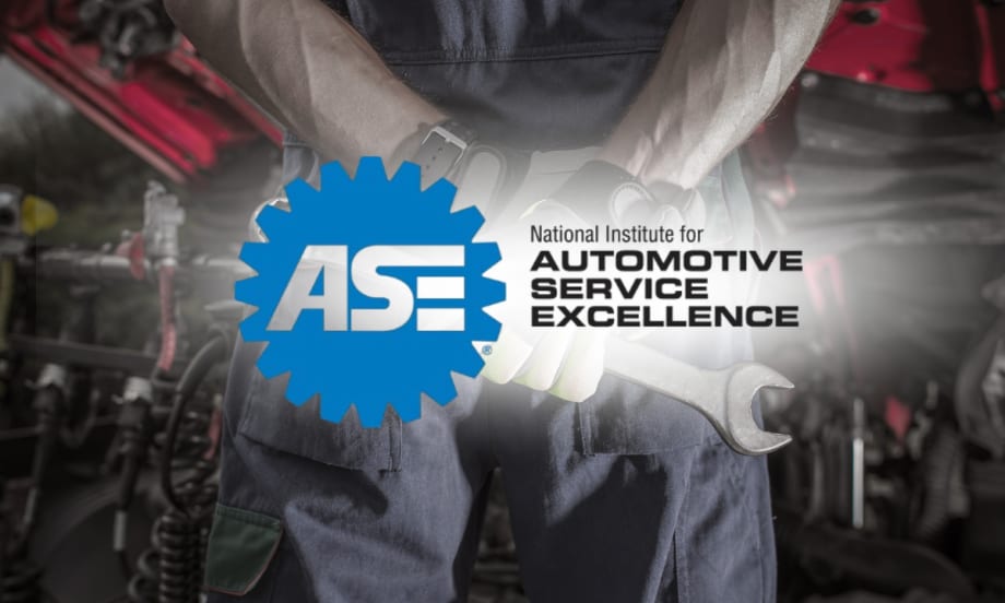 Technician holding wrench with ASE logo — ASE to discontinue five certification tests, including truck equipment and exhaust, by December 31, 2025.