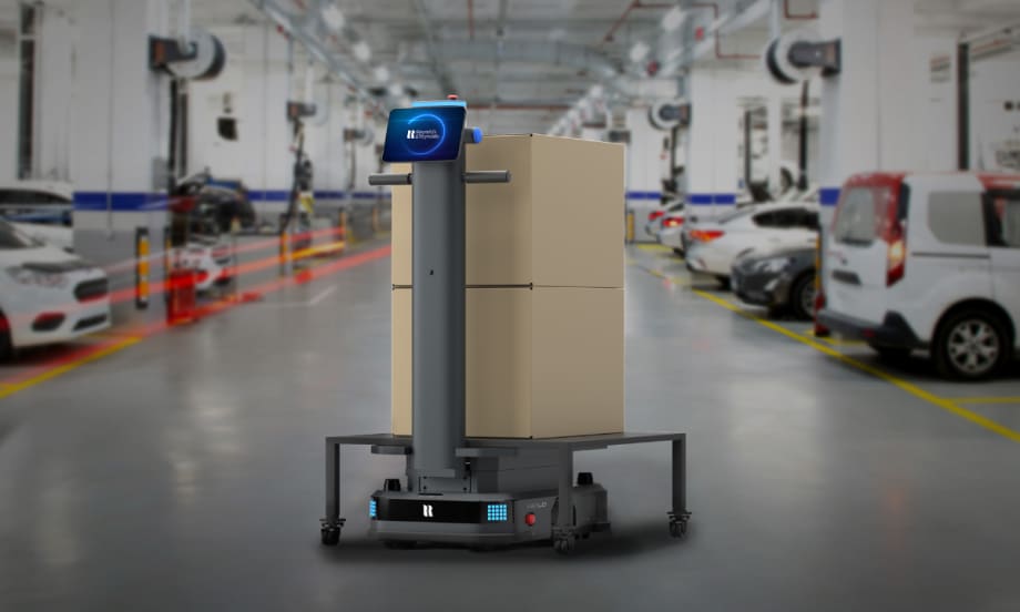 Autonomous Relo parts delivery robot from Reynolds and Reynolds carrying boxes inside an automotive service department.