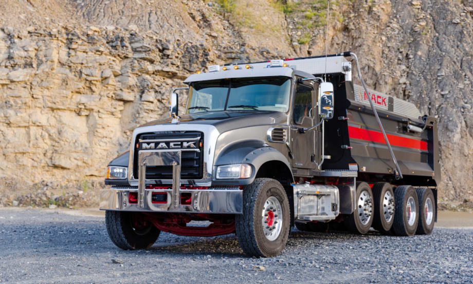 Mack dump  truck in a quarry setting.