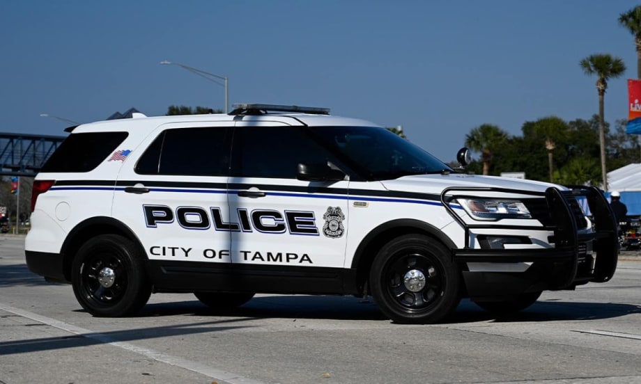 White City of Tampa police SUV parked on street with palm trees