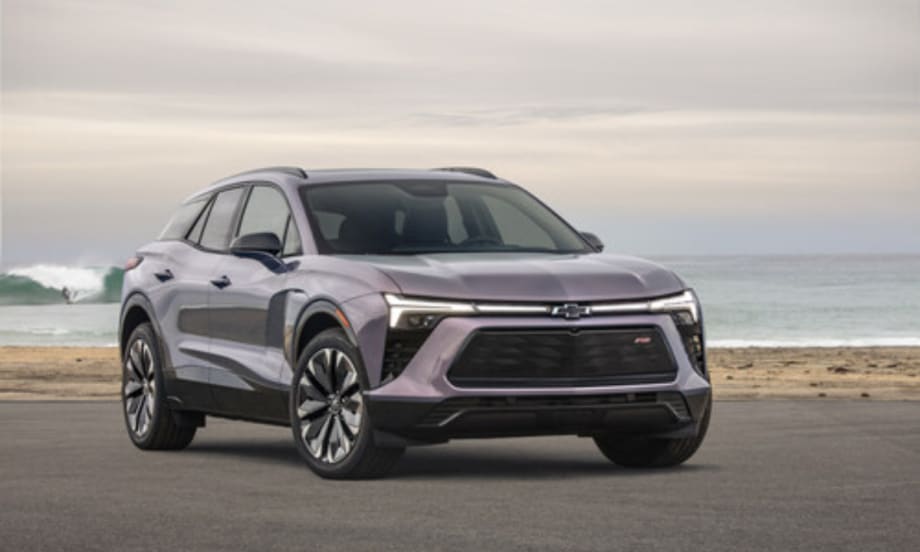 Front view of a silver Chevrolet Blazer EV parked near the ocean, named the most affordable EV to insure by Mercury Insurance.
