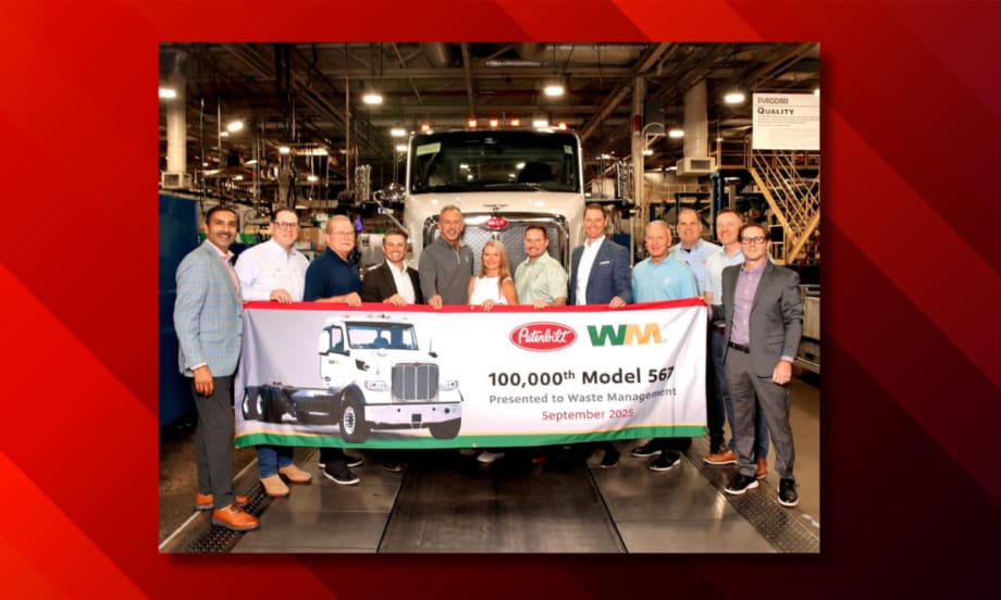 Peterbilt and WM representatives stand in front of the 100,000th Model 567 truck during a ceremony at Peterbilt’s Denton, Texas, manufacturing facility, holding a banner marking the milestone.