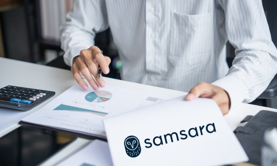 Close-up of a person reviewing charts and a document featuring the Samsara logo, representing research findings on disaster preparedness and operational resilience.