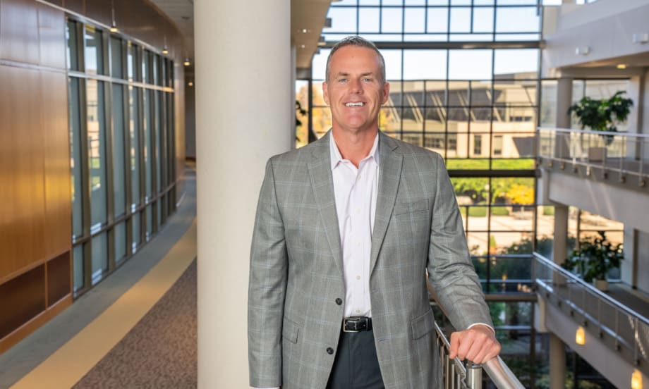 Shawn Concannon, president of TSD Mobility Solutions, stands inside a modern office building, representing TSD’s continued growth in connected-fleet technology.