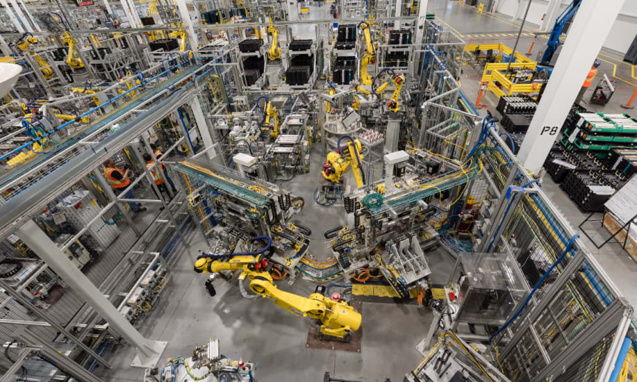 Robotic equipment operates on the production floor at GM’s CAMI Assembly plant in Ontario, where BrightDrop electric delivery vans were built before production ended.