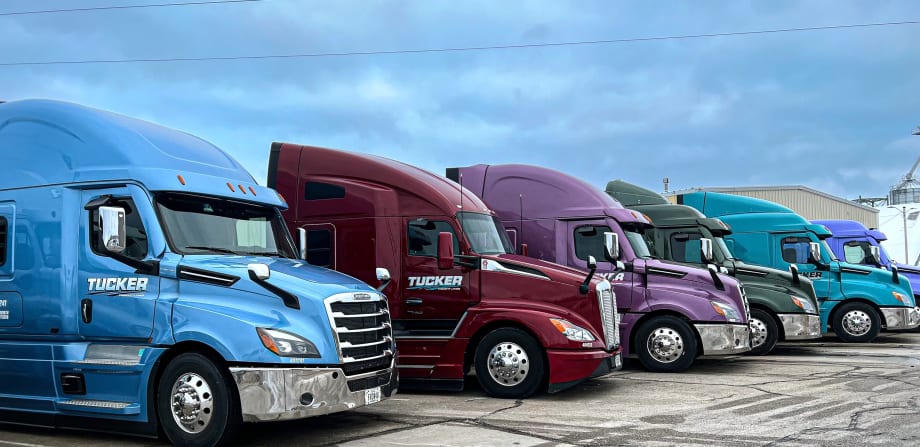Lineup of colorful Tucker Freight Lines heavy-duty tractors
