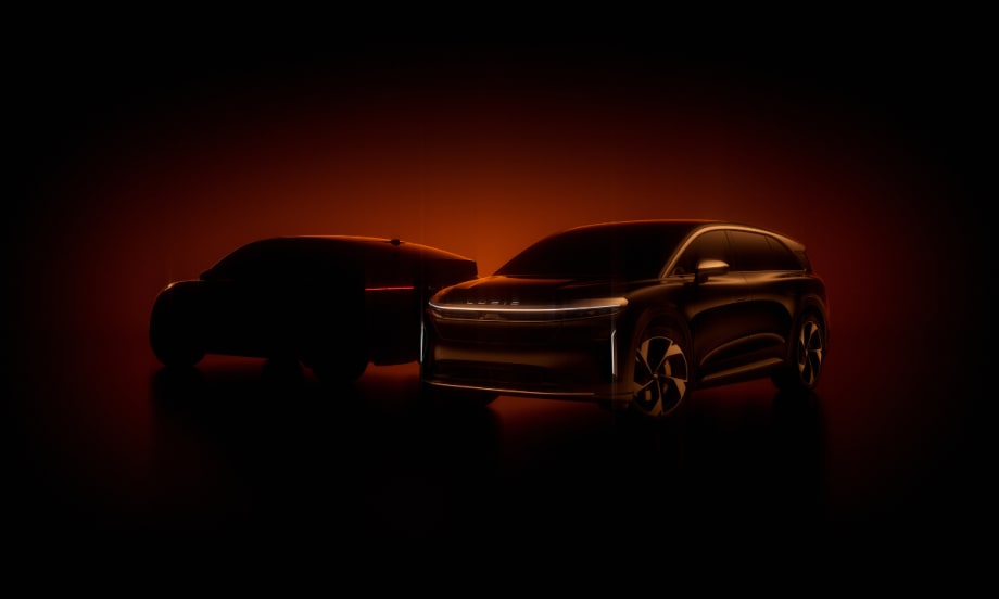 Two Lucid electric vehicles silhouetted in orange light, symbolizing the company’s partnership with NVIDIA to advance autonomous driving technology.