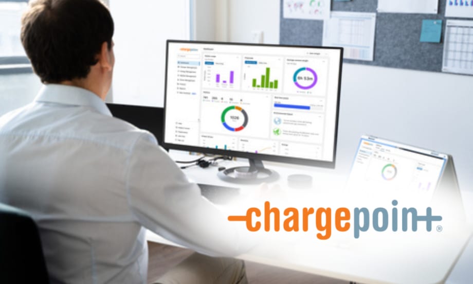 Person at a desk viewing a computer monitor with ChargePoint analytics dashboards; ChargePoint logo appears on the image.