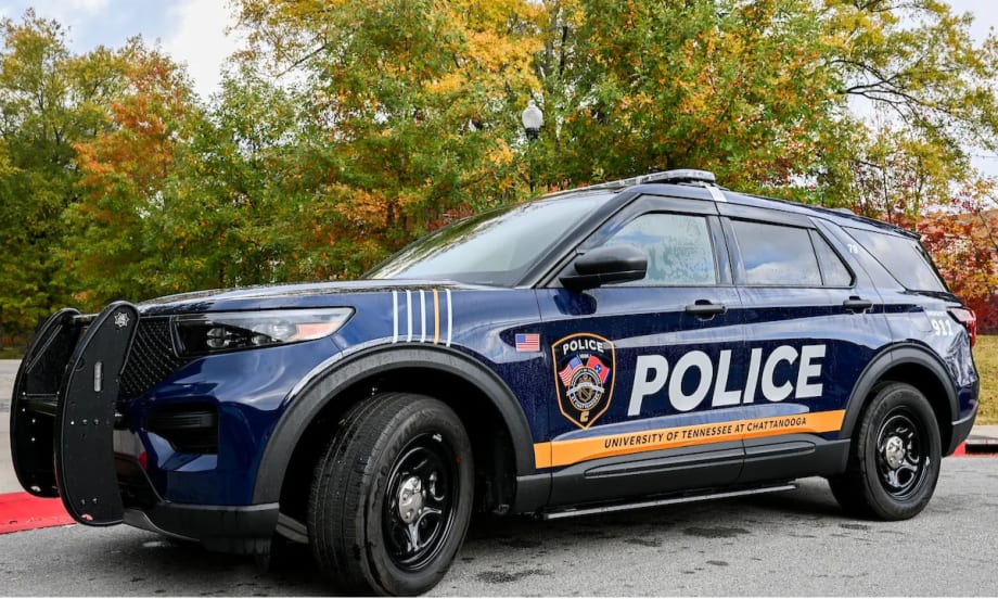 University of Tennessee at Chattanooga Police SUV parked outdoors, displaying updated blue-and-gold graphics, police markings, and university identification.