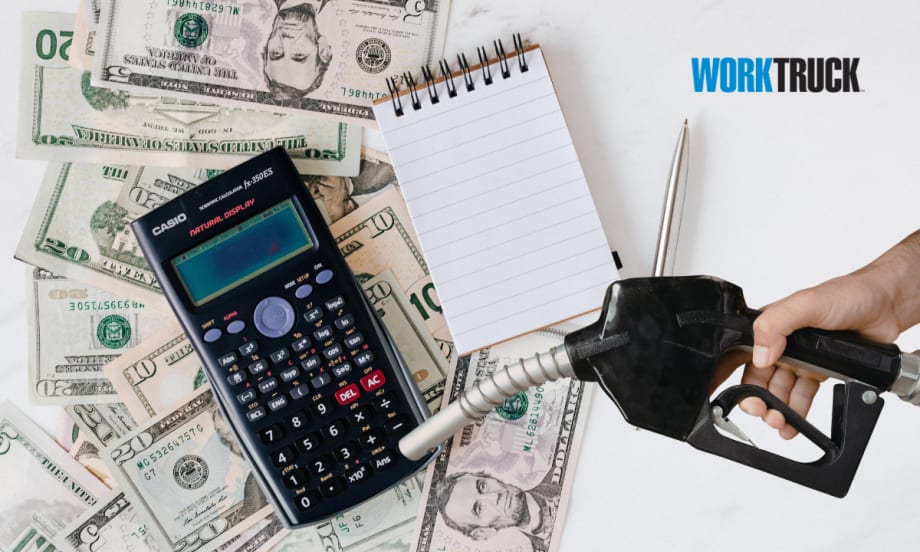 Fuel nozzle over a calculator and money signifying fuels impact on costs