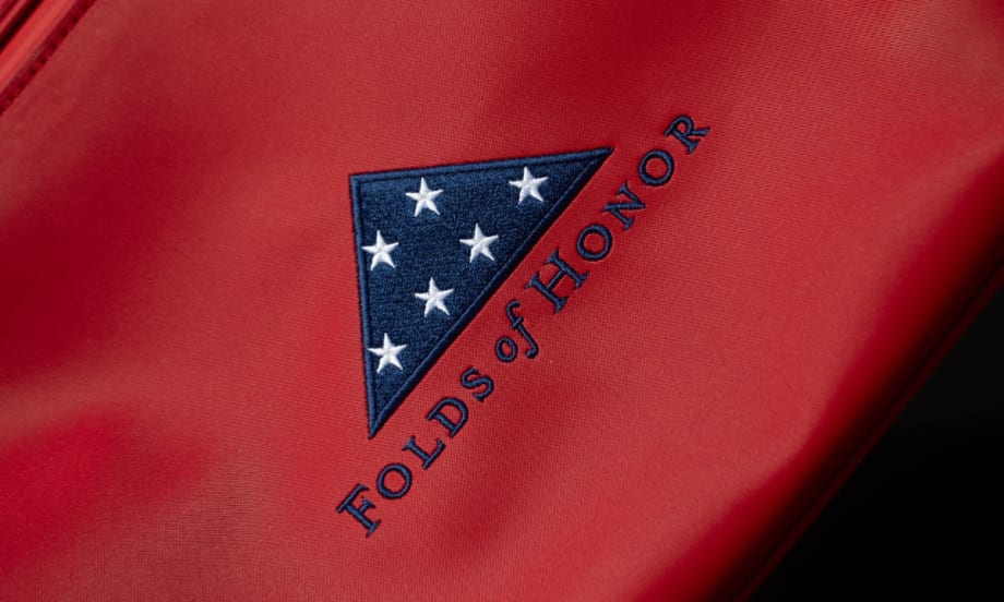 Folds of Honor logo across the red portion of flag material.