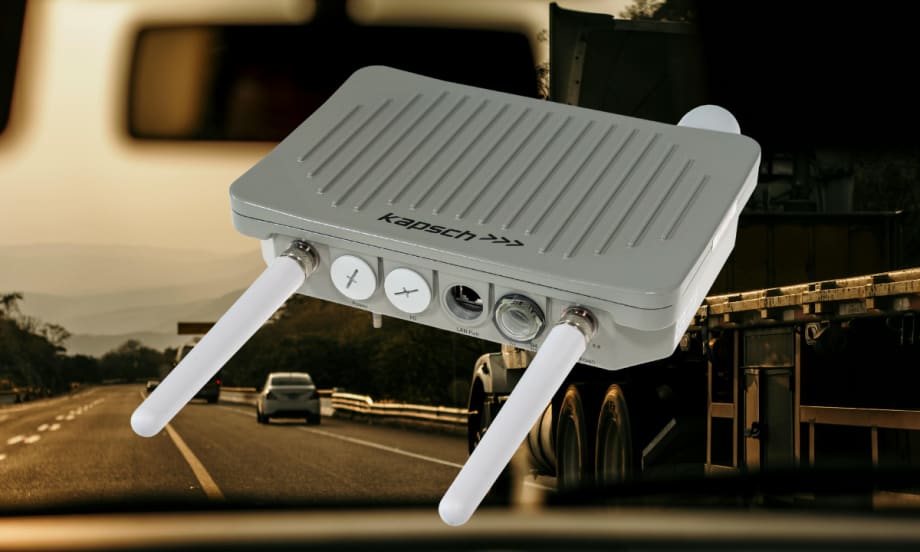 Radio communication device with two small antennas against a background image of highway traffic.