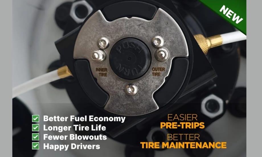 Close-up of a FlowBelow wheel cover center hub with labeled inner and outer tire valve connections and air lines attached, highlighting centralized access for tire inflation and pressure checks.