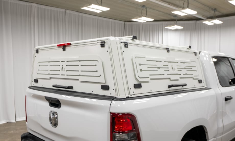 White truck cap cover installed on a white pickup truck.