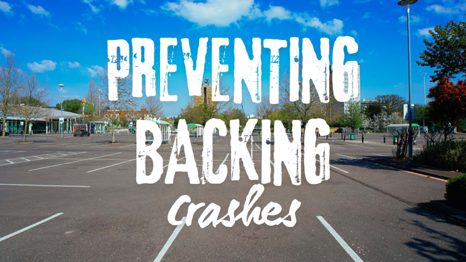 Empty parking lot representing common locations for backing accidents and the need for driver awareness and caution when reversing vehicles.
