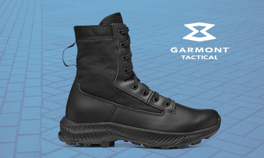 Black military style leather boot against a blue cobblestone background with a white Garmont Tactical logo.