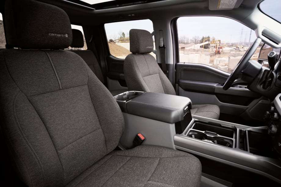 Interior view of Ford Super Duty Carhartt edition showing dark cloth seats with Carhartt logos and center console.