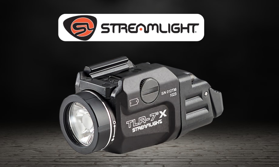 Product image of a Streamlight TLR-7 X tactical flashlight on a dark background. The compact black weapon-mounted light is shown in close-up beneath the Streamlight logo, highlighting its lens, controls, and mounting hardware.