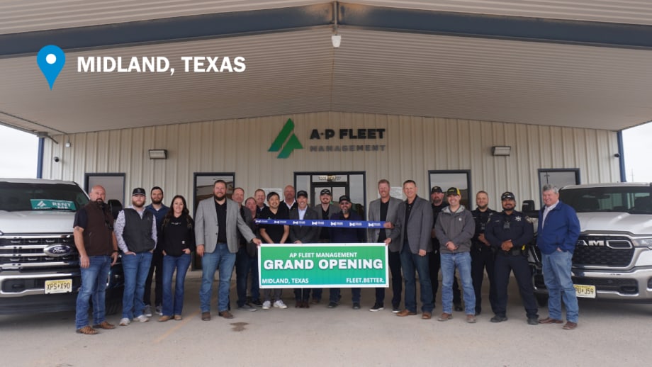 AP Fleet Management team members and local guests pose during a ribbon cutting ceremony outside the company’s new Midland, Texas, fleet facility alongside commercial pickup trucks.