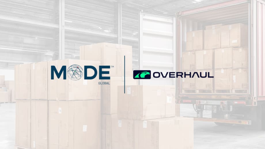 MODE Global and Overhaul logos displayed over a warehouse scene with stacked shipping boxes and a loaded trailer, illustrating a logistics technology partnership focused on freight visibility and supply chain operations.