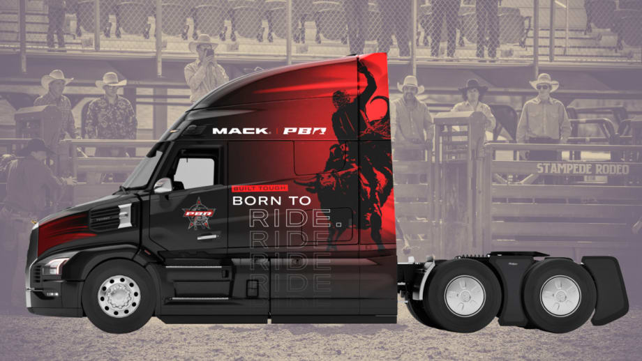 Mack Pioneer tractor features a black-and-red Professional Bull Riders design with “Built Tough, Born to Ride” graphics, displayed against a rodeo arena background with cowboys.