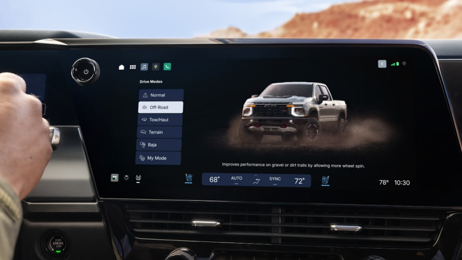 Close-up of the 2027 Chevrolet Silverado center touchscreen displaying drive modes including Normal, Off-Road, Tow/Haul, Terrain, Baja, and My Mode.