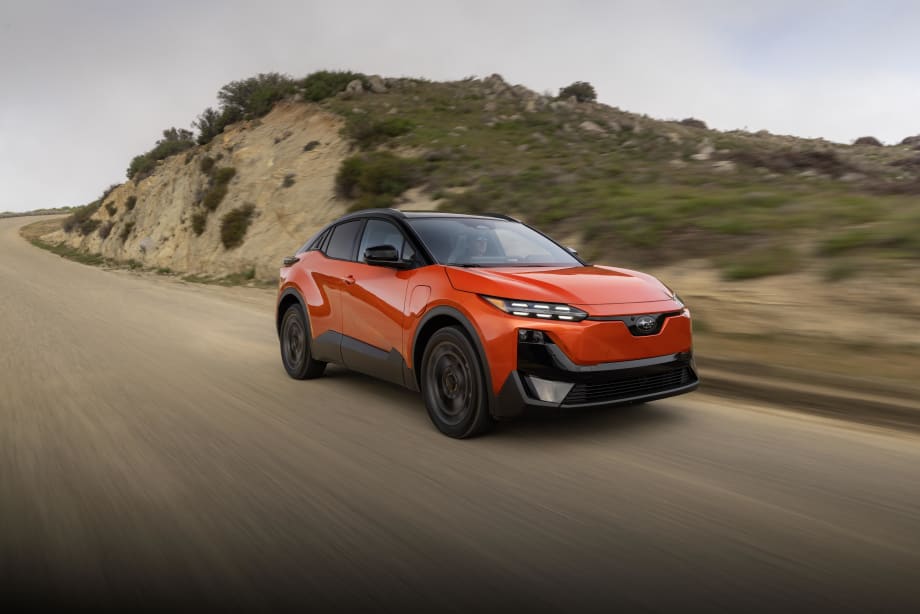 A 2027 red subaru uncharted drives down a road
