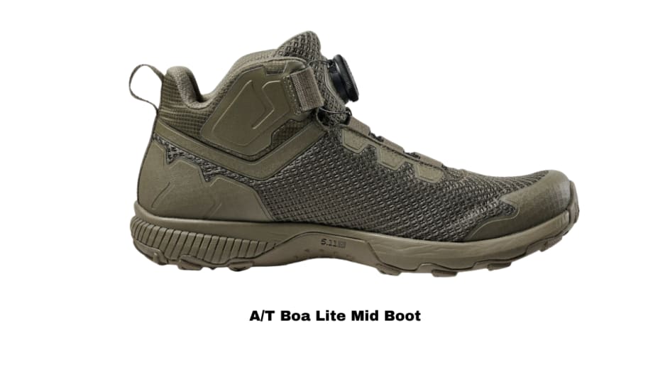 Side profile view of a mid-cut boot in green