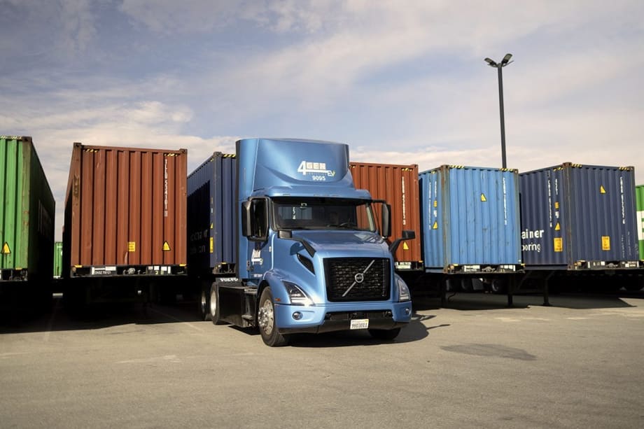 Electric Volvo VNR truck with intermodal containers at port