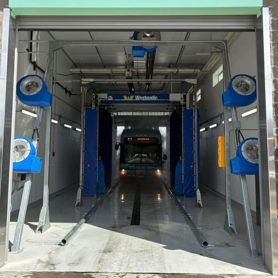 An ABQ RIDE bus going through a Westmatic wash system.