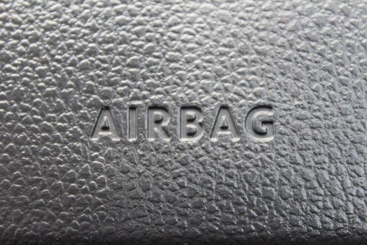 Closeup photo of 'airbag' stamp on a car dash