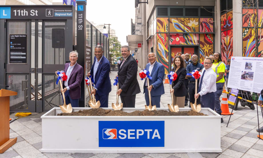 Six people hold shovels in dirt at the SEPTA 11th Street Station ground breaking.