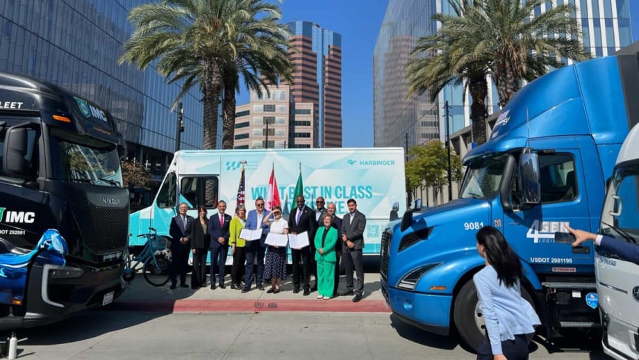 Group of people and zero-emission trucks during ceremony announcing a West Coast ZEV corridor.