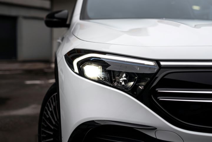 Closeup photo of the front of a white car