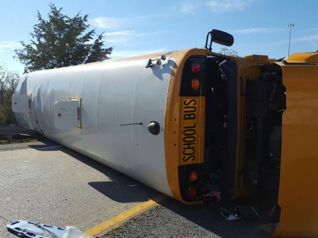 School Bus Overturns, Dozens of Students Injured
