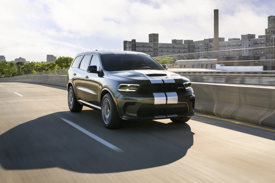 Photo of Dodge Durango moving down a road in sunlight