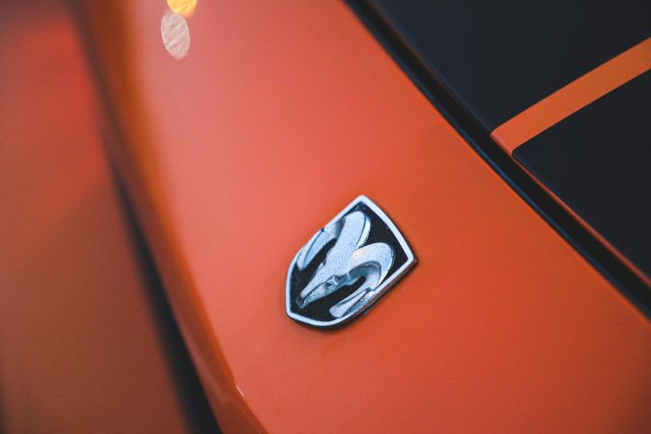 Dodge emblem on orange vehicle